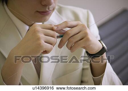 Stock Photograph - Businessman holding pen. Fotosearch