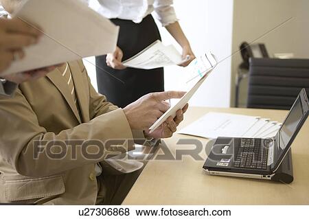 Stock Photo - Businessman in the office. Fotosearch