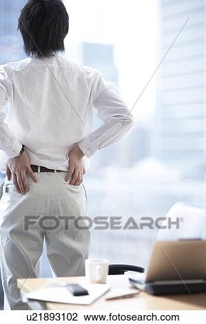 Businessman looking out the window View Large Photo Image Stock Image - Businessman looking out the window. Fotosearch