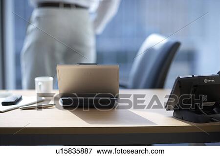 Stock Photo - Businessman looking out the window. Fotosearch