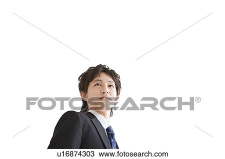 Businessman, low angle view View Large Photo Image Stock Image - Businessman, low angle view. Fotosearch