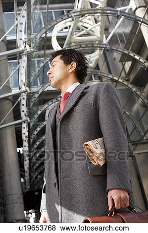 Stock Photo - Businessman Outside Office Building. Fotosearch