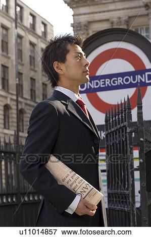 Stock Photo - Businessman Outside Undeground Station. Fotosearch