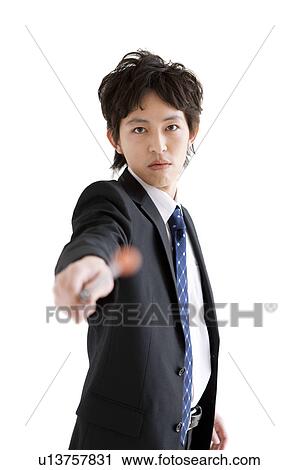 Stock Image - Businessman pointing with pointer. Fotosearch