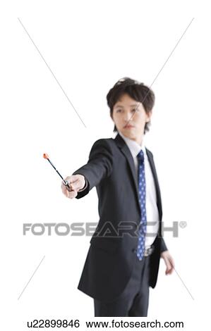 Stock Photograph - Businessman pointing with pointer. Fotosearch