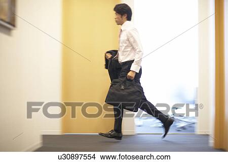 Picture - Businessman Running. Fotosearch