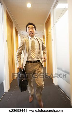 Stock Image - Businessman Running. Fotosearch