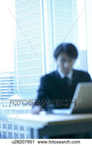 Businessman sitting in an office, Tokyo Prefecture, Honshu, Japan View Large Photo Image Stock Image - Businessman sitting in an office, Tokyo Prefecture, Honshu, Japan. Fotosearch