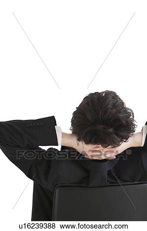 Businessman sitting on chair relaxing View Large Photo Image Stock Photo - Businessman sitting on chair relaxing. Fotosearch