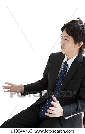 Businessman sitting on chair talking View Large Photo Image Stock Photograph - Businessman sitting on chair talking. Fotosearch