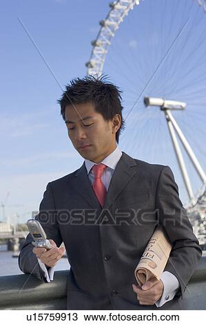 Businessman Using Mobile Phone Near London Eye View Large Photo Image Stock Image - Businessman Using Mobile Phone Near London Eye. Fotosearch
