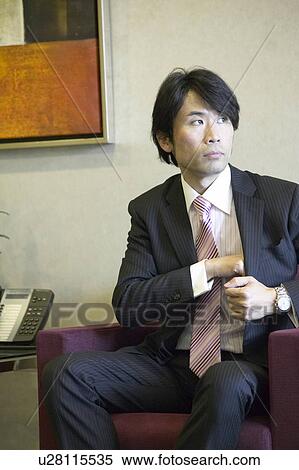 Businessman waiting at reception area View Large Photo Image Stock Photography - Businessman waiting at reception area. Fotosearch