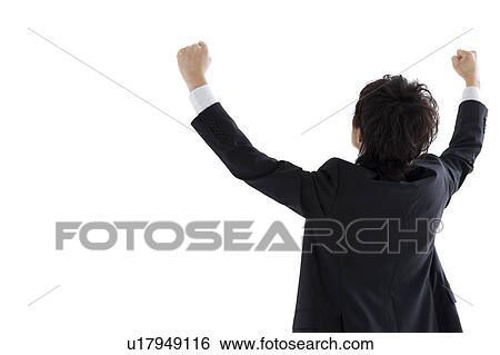 Stock Photograph - Businessman with arms raised, Rear View. Fotosearch
