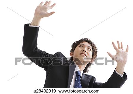 Stock Photo - Businessman with arms raised. Fotosearch