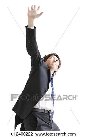 Businessman with hand raised View Large Photo Image Stock Image - Businessman with hand raised. Fotosearch