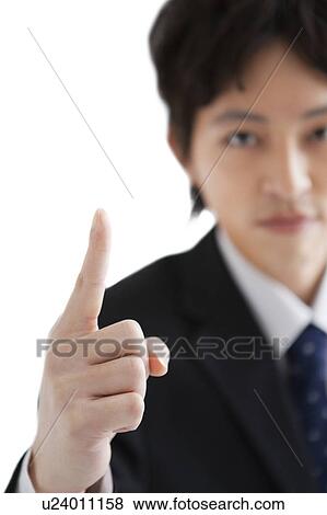 Stock Photo - Businessman with hand raised. Fotosearch