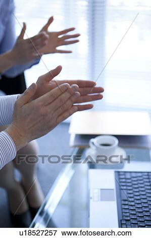Stock Photo - Businesspeople clapping hands. Fotosearch