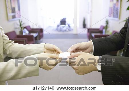 Businesspeople exchanging business card View Large Photo Image Stock Image - Businesspeople exchanging business card. Fotosearch