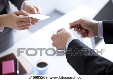 Businesspeople exchanging business cards View Large Photo Image Stock Photo - Businesspeople exchanging business cards. Fotosearch