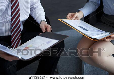 Picture - Businesspeople having a meeting. Fotosearch