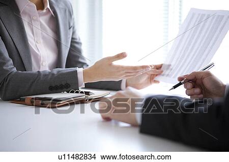 Picture - Businesspeople having a meeting. Fotosearch