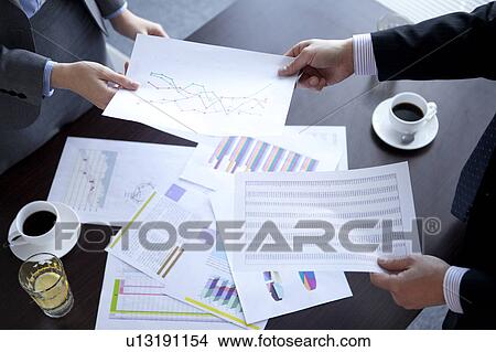 Businesspeople having a meeting View Large Photo Image Picture - Businesspeople having a meeting. Fotosearch