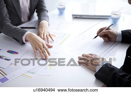 Picture - Businesspeople having a meeting. Fotosearch