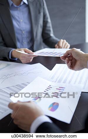 Picture - Businesspeople having a meeting. Fotosearch