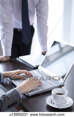 Businesspeople having a meeting View Large Photo Image Stock Image - Businesspeople having a meeting. Fotosearch