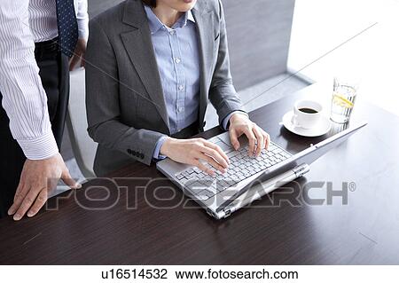 Businesspeople having a meeting View Large Photo Image Stock Image - Businesspeople having a meeting. Fotosearch
