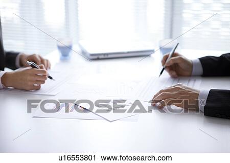 Businesspeople having a meeting View Large Photo Image Stock Image - Businesspeople having a meeting. Fotosearch