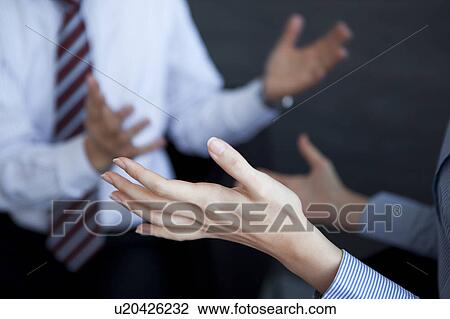 Businesspeople having a meeting View Large Photo Image Stock Image - Businesspeople having a meeting. Fotosearch