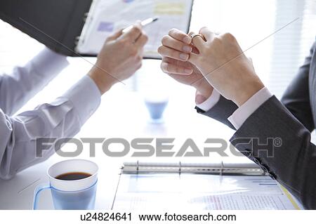 Businesspeople having a meeting View Large Photo Image Stock Image - Businesspeople having a meeting. Fotosearch