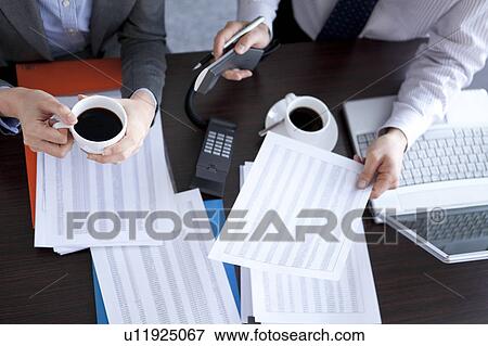 Businesspeople having a meeting View Large Photo Image Stock Photo - Businesspeople having a meeting. Fotosearch