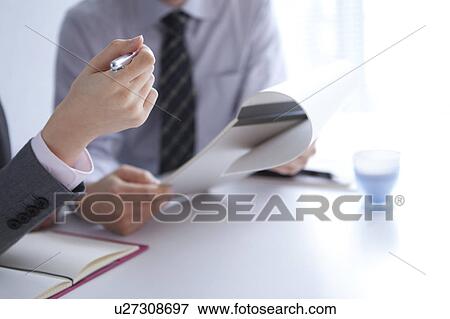 Businesspeople having a meeting View Large Photo Image Stock Photo - Businesspeople having a meeting. Fotosearch