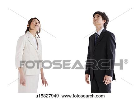 Stock Photo - Businesspeople looking up. Fotosearch