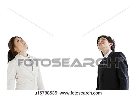 Stock Photograph - Businesspeople looking up. Fotosearch