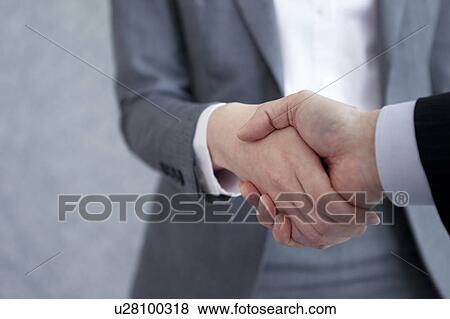 Stock Photo - Businesspeople shaking hands. Fotosearch