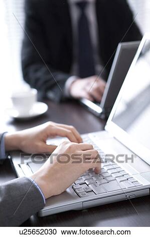 Businesspeople using laptop View Large Photo Image Stock Image - Businesspeople using laptop. Fotosearch
