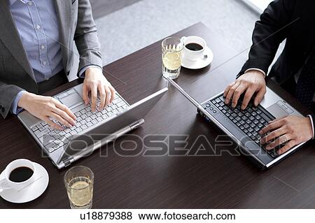 Businesspeople using laptop View Large Photo Image Stock Photo - Businesspeople using laptop. Fotosearch