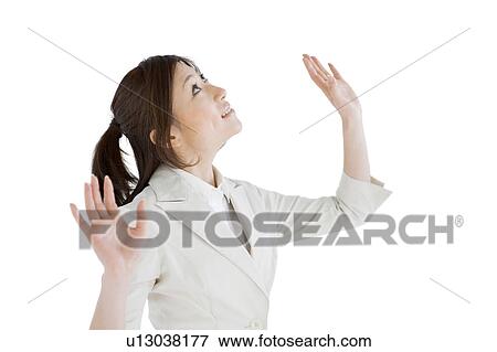 Stock Photo - Businesswoman looking up. Fotosearch