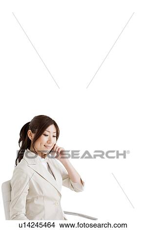 Picture - Businesswoman on cell phone. Fotosearch