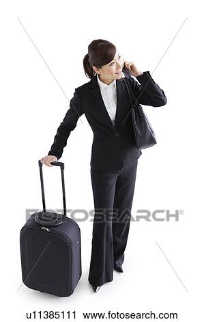Stock Image - Businesswoman on cell phone. Fotosearch