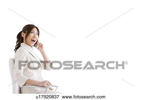 Businesswoman on cell phone View Large Photo Image Stock Photo - Businesswoman on cell phone. Fotosearch