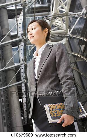 Stock Photo - Businesswoman Outside Office Building. Fotosearch