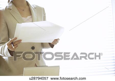 Businesswoman presenting, midsection View Large Photo Image Stock Photo - Businesswoman presenting, midsection. Fotosearch