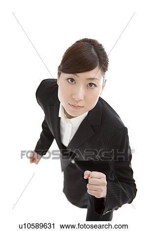 Stock Image - Businesswoman running. Fotosearch