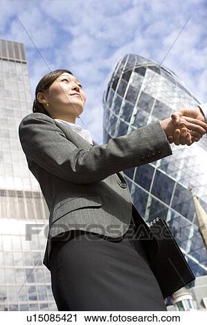 Businesswoman Shaking Hands Near Gherkin View Large Photo Image Stock Image - Businesswoman Shaking Hands Near Gherkin. Fotosearch