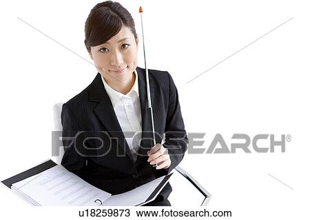 Businesswoman sitting on chair with binder and pointer View Large Photo Image Stock Image - Businesswoman sitting on chair with binder and pointer. Fotosearch