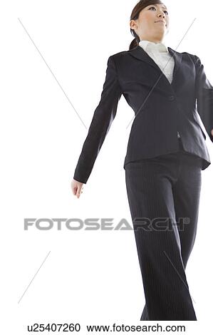Stock Image - Businesswoman walking. Fotosearch